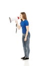 Screaming young woman with megaphone. Royalty Free Stock Photo