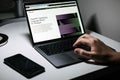 Screen with ChatGPT chat with AI or artificial intelligence. Man search for information using artificial intelligence