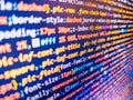 Screen of colored lighted syntax of source code script with defocus. Finance data concept. Abstract technology background. Royalty Free Stock Photo