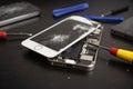 Screen cracked smartphone. Mobile phone with damaged touchscreen. Replacing broken screen.