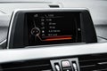 Screen multimedia system on dashboard in a modern car. Royalty Free Stock Photo