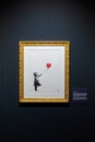 Screen print titled Girl with Balloon by Banksy, Salone degli Incanti. Trieste