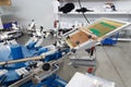 Screen printing machine for applying images by silkscreen printing