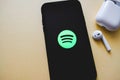 Screen shot of Spotify app showing on iPhone X with AirPods. Royalty Free Stock Photo