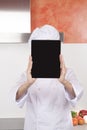 Screen tablet over chef face