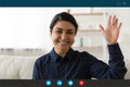 Smiling Indian woman wave talking on video call Royalty Free Stock Photo