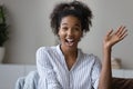 Screen view of smiling biracial woman talk on video call