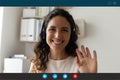 Screen view of smiling woman wave talking online