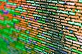 Screen of web developing php code on dark background. WWW software development. Laptop screen show abstract computer programming Royalty Free Stock Photo