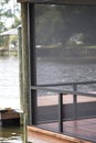 Screened enclosure on dock over water