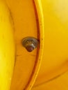 joint point of yellow plastic tubes. Detail of cross of plastic and iron