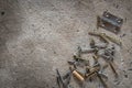 Screw, nail on concrete texture background. Closeup of screws and nails on cement floor, copy space Royalty Free Stock Photo