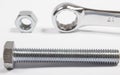 Screw, nut, wrench on white Royalty Free Stock Photo
