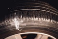 screw protruding from the tread of a tire causing a flat. Royalty Free Stock Photo