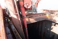 screw type ship unloader boom discharging cargo from ship's hold