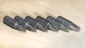 Screwdrive replaceable bits on a wooden background Royalty Free Stock Photo