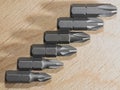 Screwdrive replaceable bits on a wooden background Royalty Free Stock Photo