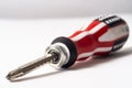 Screwdriver with an American flag color handle on a white Royalty Free Stock Photo