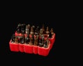 Screwdriver bits in a red rubber organizer box