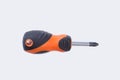 Screwdriver with black and orange rubber handle.