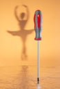 A screwdriver dancing like a ballerina in the hands of a skilled craftsman