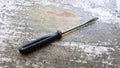 screwdriver on an old painted wod background Royalty Free Stock Photo