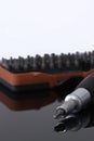 Screwdriver with phillips head with various bits in a case in the background reflected Royalty Free Stock Photo