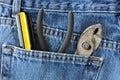 Screwdriver and Pliers in Blue Jeans Pocket Royalty Free Stock Photo