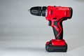 Screwdriver with rechargeable batteries, red, modern and reliable