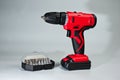 Screwdriver with rechargeable batteries, red, modern and reliable