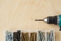 Screwdriver and screws of different sizes in box Royalty Free Stock Photo