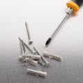 Screwdriver, screws and plastic dowels