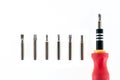 A screwdriver with a set of changable nozzels isolate on white b Royalty Free Stock Photo