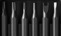 Screwdriver tips different shapes and sizes close up. Manual metal mini screwdriver and set of the interchangeable bits Royalty Free Stock Photo