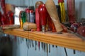 Various screwdrivers in a dusty wooden shelf in the workshop of a craftsman, selected focus