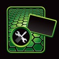 Screwdriver and wrench on green hexagon ad Royalty Free Stock Photo