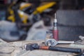 Screwdriver, wrench and hammer on a metal workbench in a workshop. Royalty Free Stock Photo