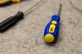 Screwdriver yellow blue repair home master fasteners fixation end rubber handle protection Royalty Free Stock Photo