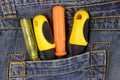 Screwdrivers in pocket of blue jeans Royalty Free Stock Photo