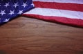 Screwed Up USA Flag on Brown Wooden Board Background Royalty Free Stock Photo