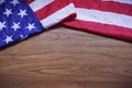 Screwed Up USA Flag on Brown Wooden Board Background Royalty Free Stock Photo