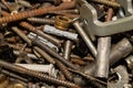 Screws background. heap of tapping screws. work tool. pile of fasteners. bolts and nuts. metal scrape Royalty Free Stock Photo