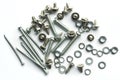 Screws, bolts, nails on white background
