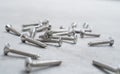 Screws on a cement background Royalty Free Stock Photo