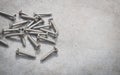 Screws on a cement background Royalty Free Stock Photo