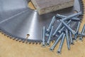 Screws, confirmations for furniture, are on the table. Furniture production Royalty Free Stock Photo