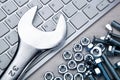 Screws fastening materials and pc keyboard and a wrench Royalty Free Stock Photo