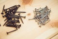 Screws, nails, bolts srt on the wooden table Royalty Free Stock Photo