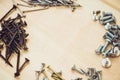 Screws, nails, bolts srt on the wooden table Royalty Free Stock Photo