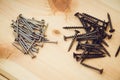 Screws, nails, bolts srt on the wooden table Royalty Free Stock Photo